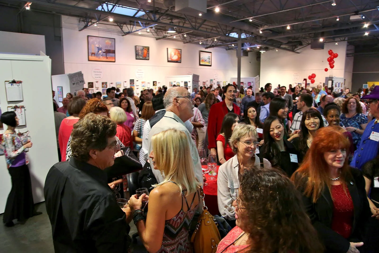 Attendees gathering at the Red/Dot Auction event